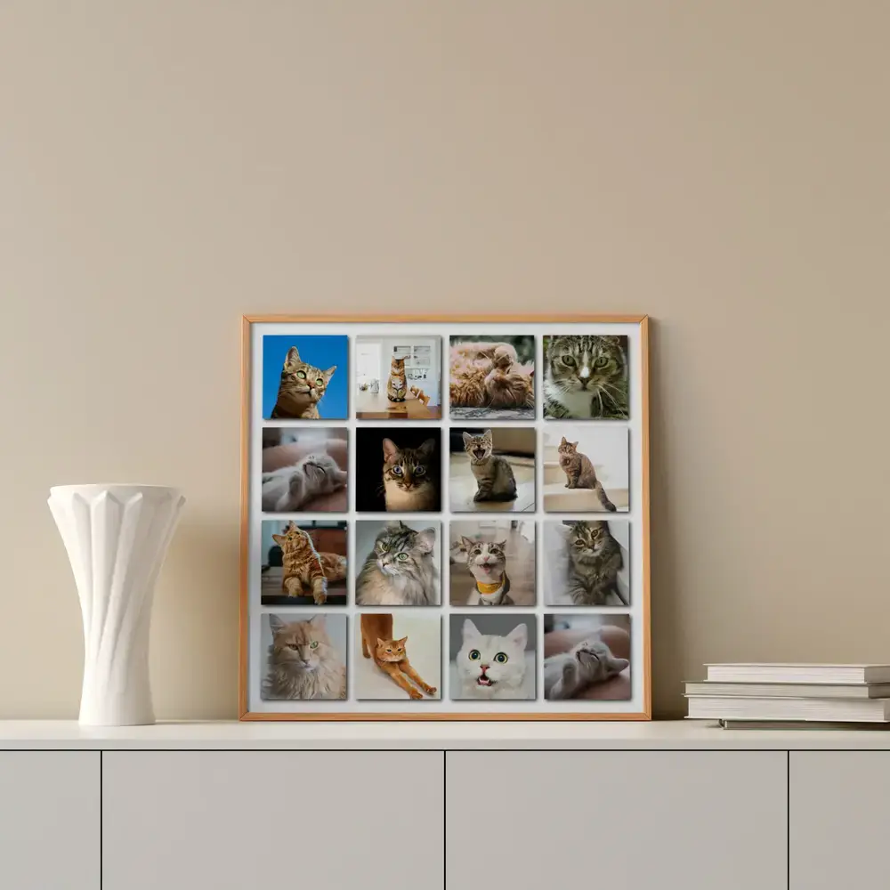 Wood-framed collage of 16 cat photos on a white sideboard beside a vase and books, a gift for cat lovers