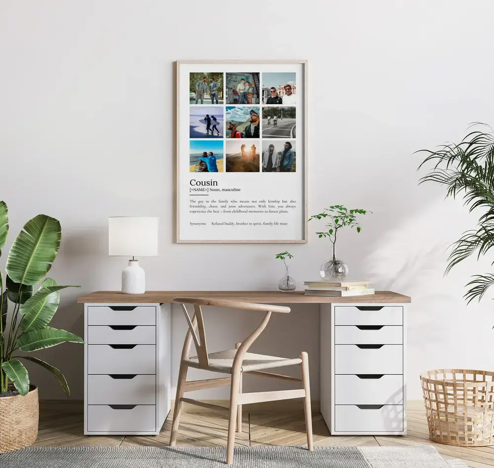 Cousin definition photo collage in a light wood frame above a desk in a bright home office