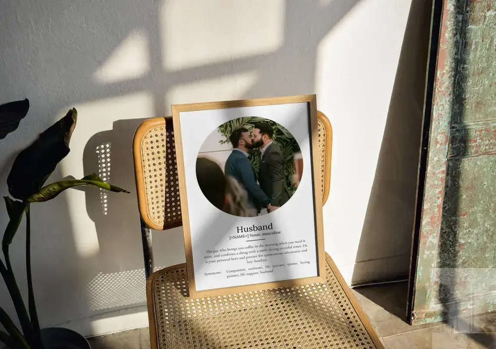 Husband definition poster with a circular wedding photo in a natural wood frame on a sunlit cane chair