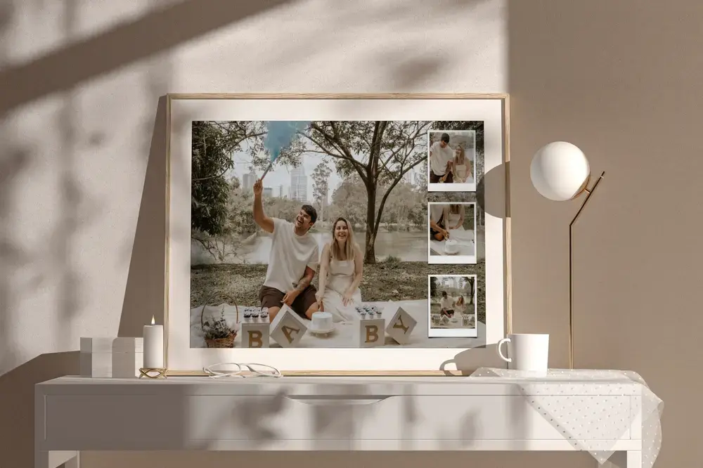 Wood-framed gender reveal photo collage on a light dresser beside a lamp, a gift idea for expecting parents