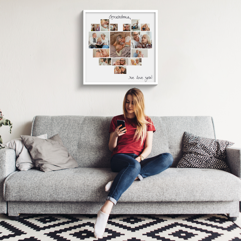 Heart photo collage with a personal message in a white frame above a gray living room sofa