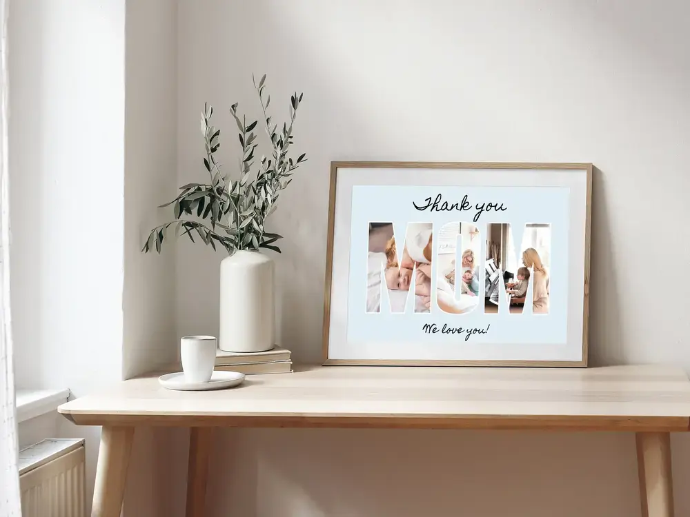 Photo letter collage for Mom with a pale blue background and loving message, in a wood frame on a desk