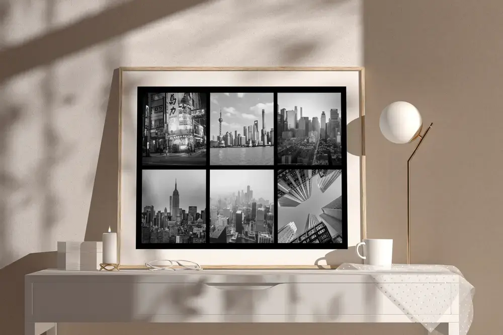 Black-and-white city photo collage in a wood frame on a light sideboard, a gift to remember a trip