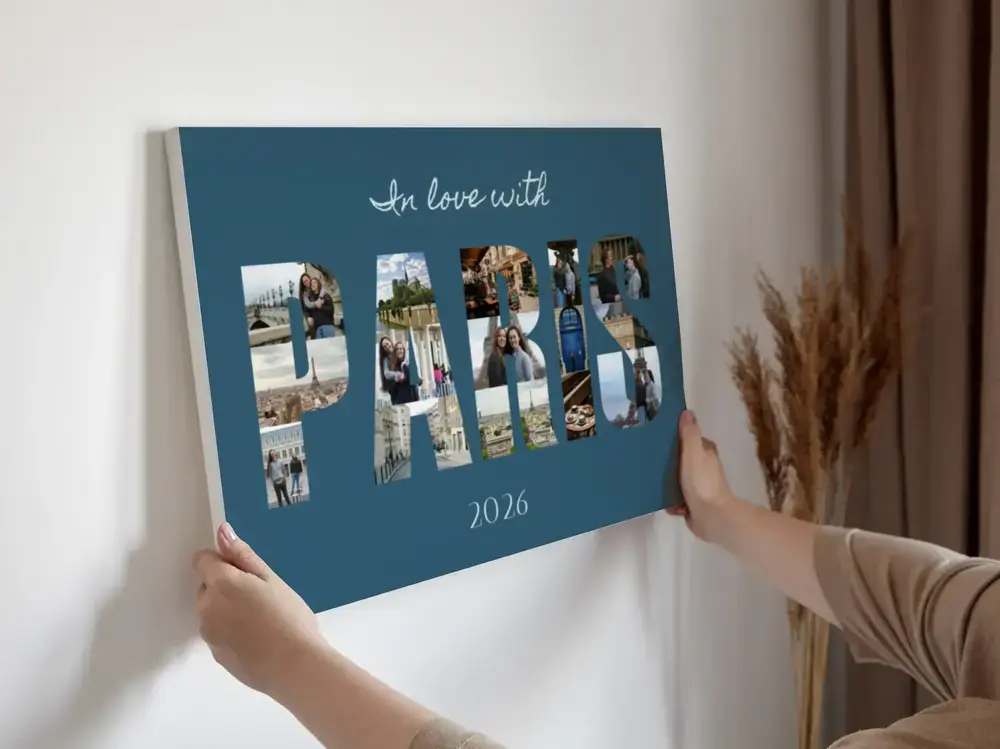 Teal canvas with vacation photos filling city-name letters and a year below, displayed against a light wall