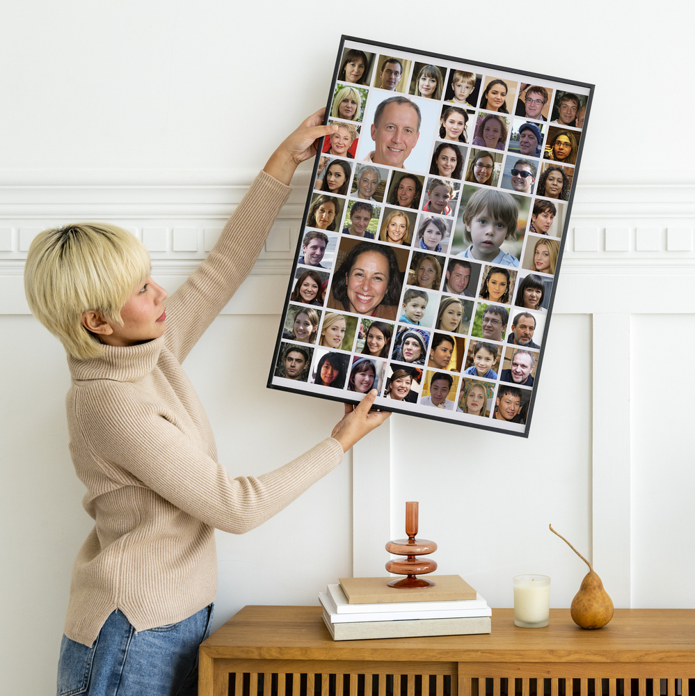 Framed photo collage with large and small portraits above a sideboard against a white wall, a thoughtful team gift
