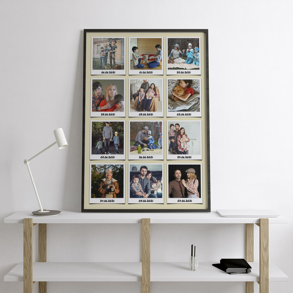 Travel journal photo collage with 12 dated instant-style prints in a dark frame on a white console beside a lamp